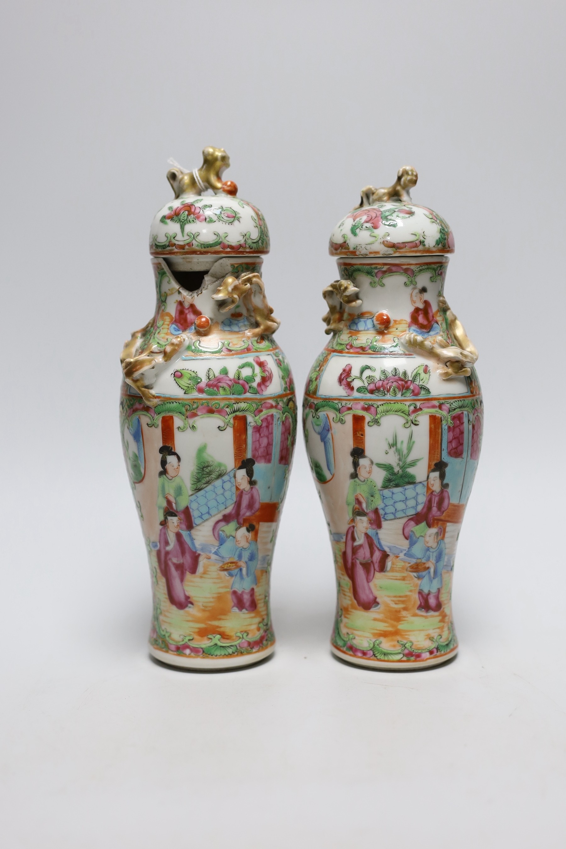 A pair of 19th century Chinese famille rose vases and covers, 24cms high